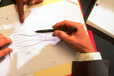 Photo of Hands & a Chart
